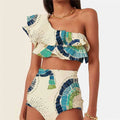 Women's white one-shoulder swimsuit with lotus leaf design and side split detail.