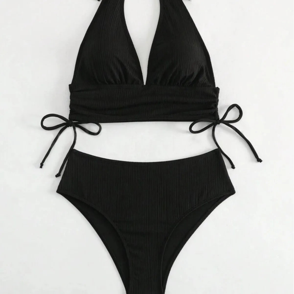 Women's black lace-up halter bikini set with briefs on mannequin