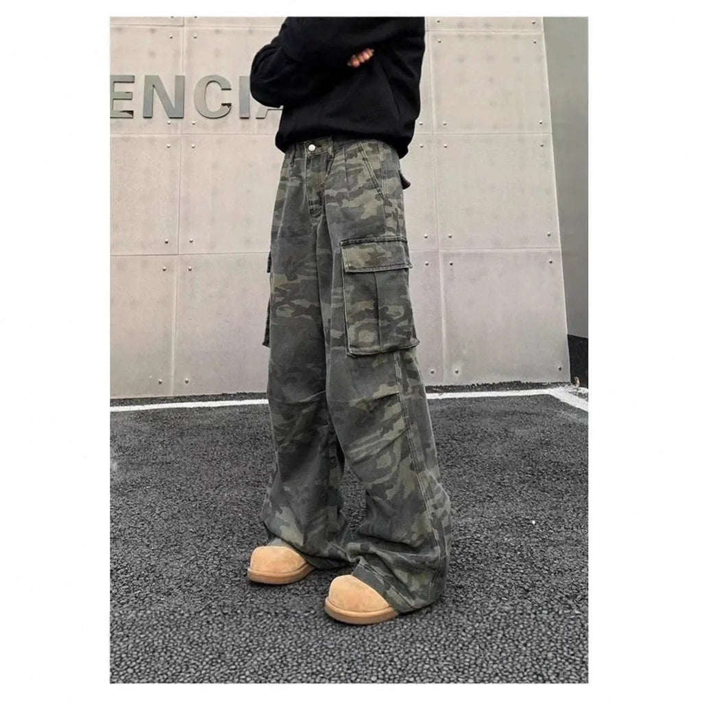 American Vintage camouflage cargo pants with multiple pockets and a washed, crumpled fabric texture.