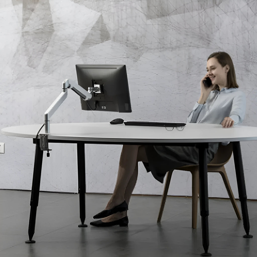 Aluminium laptop stand with adjustable arm bracket in silver colour on desk