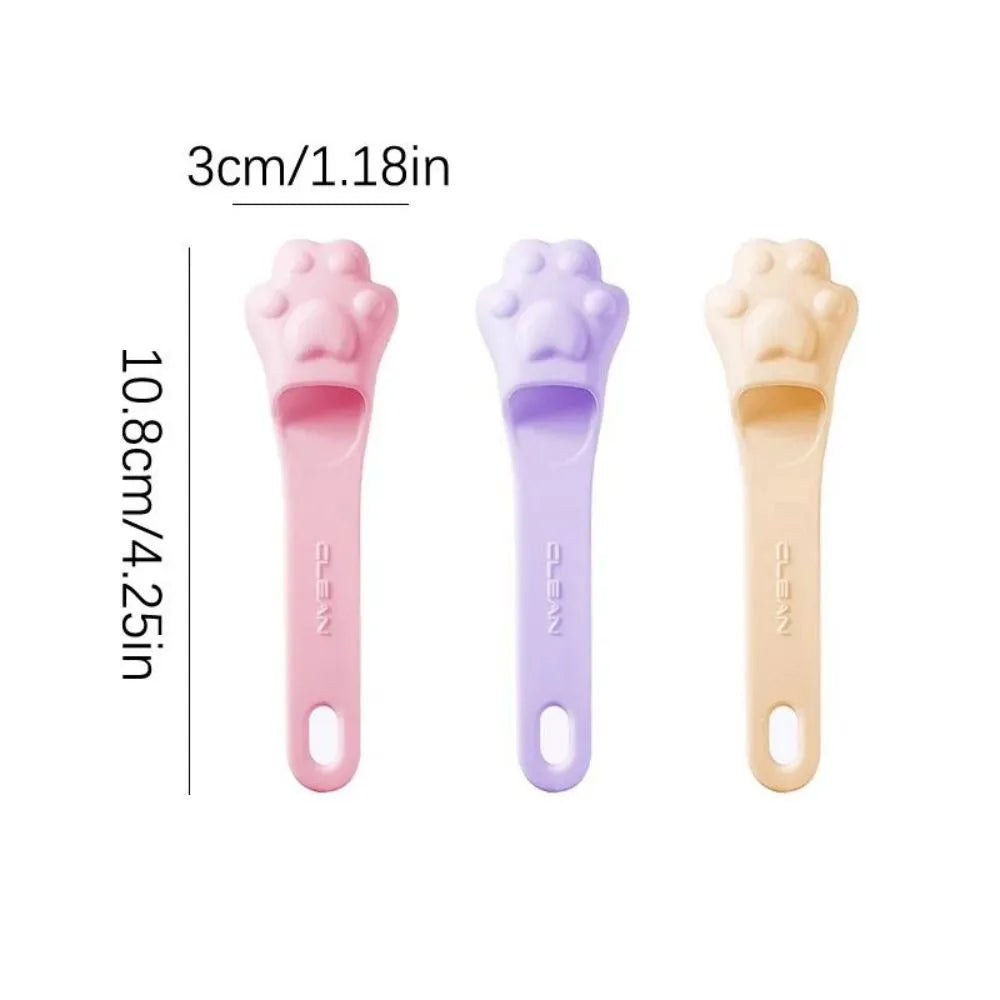 Pink silicone finger cover toothbrush for pets on a white background