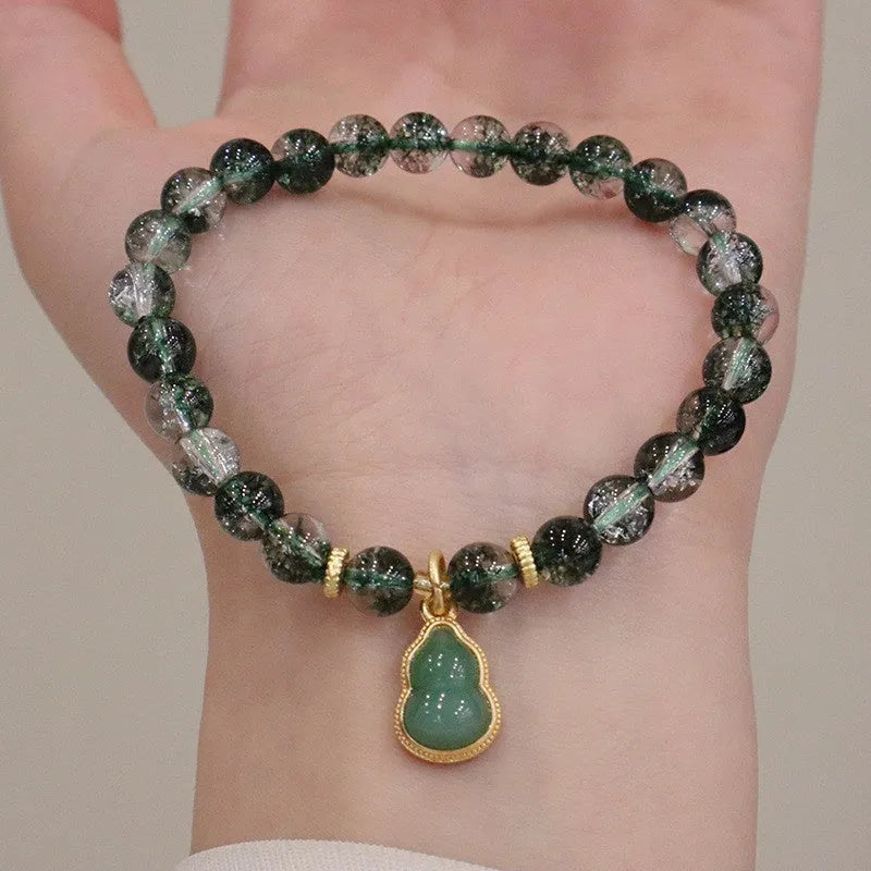 Women's crystal bracelet with green phantom quartz heart pendant and natural chorite details