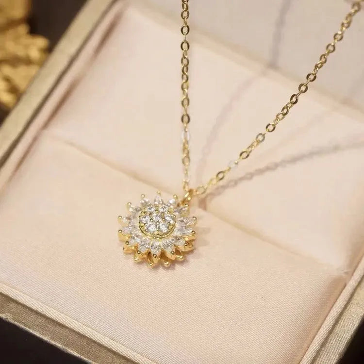 Rotatable sunflower pendant necklace with zircon stones on gold-plated copper chain in golden finish