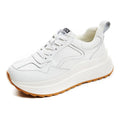 Women's beige cattlehide leather casual sports shoes with cross strap detail and low-top design