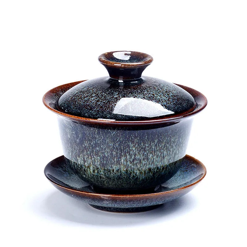 Handcrafted ceramic three-piece tea set with covered bowl and teacup in transmutation glaze finish