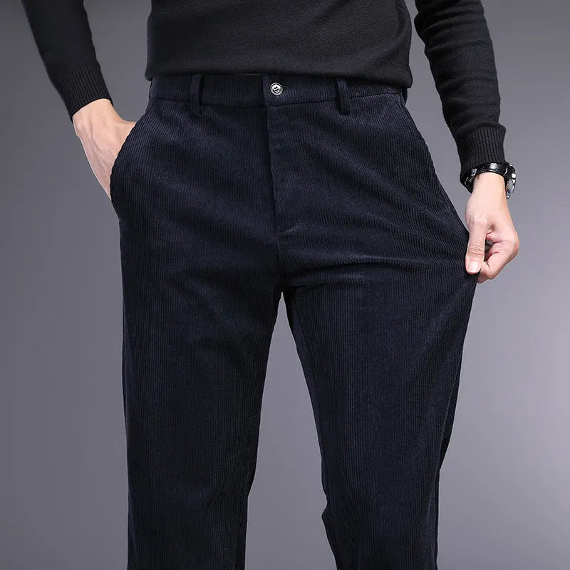 British retro style striped straight-leg trousers in a khaki colour, showing zip fly and classic cut.