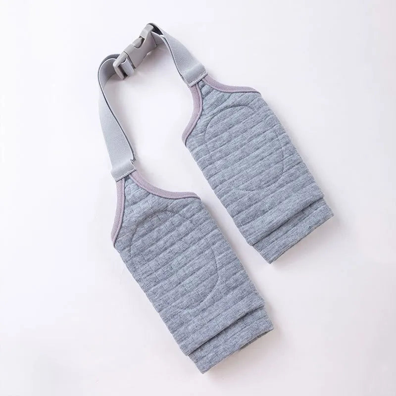 Blue adjustable dog knee protector sleeve with padded elbow patch and matching scarf laid flat.