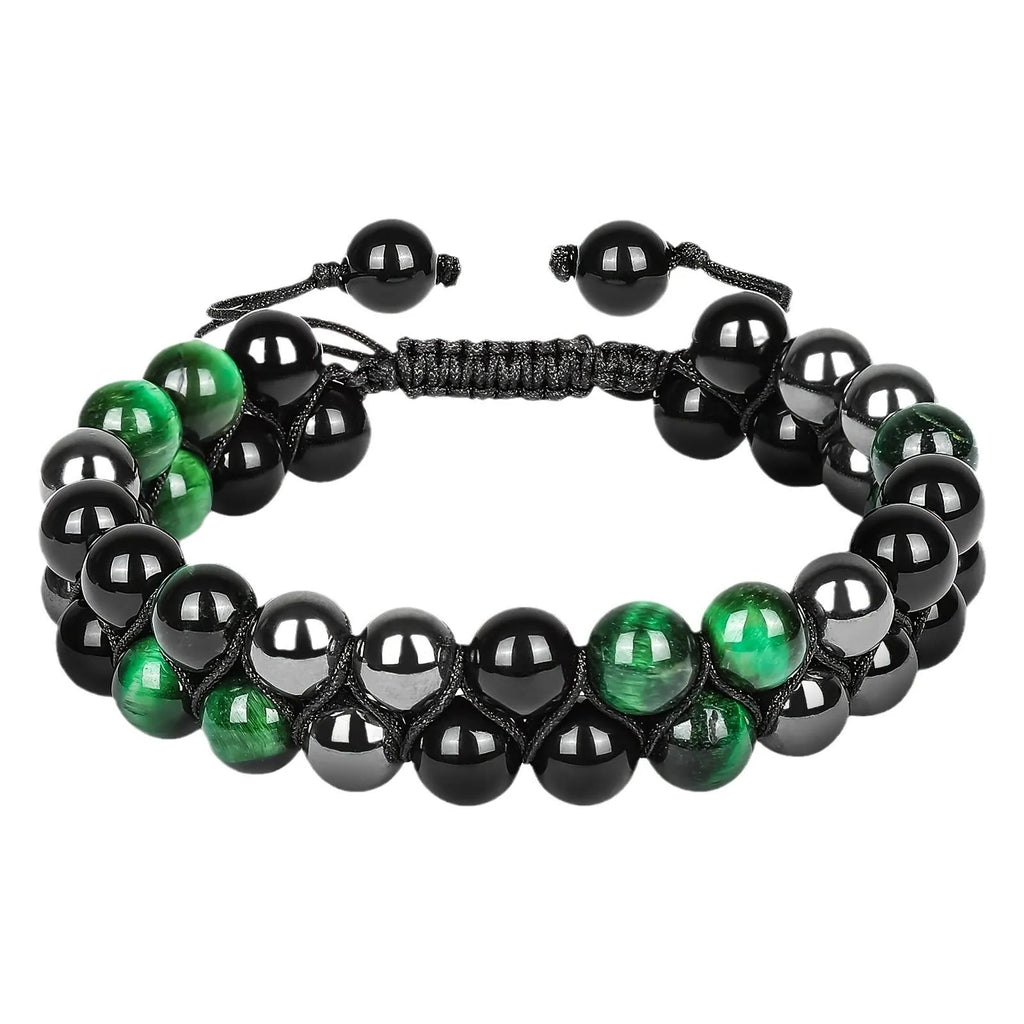 Handmade Tiger's Eye and alloy bracelet with auspicious elephant charms on wrist.