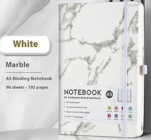 A5 size notebook with soft skin-feel PU leather cover and strap closure, open to show horizontal lined pages.