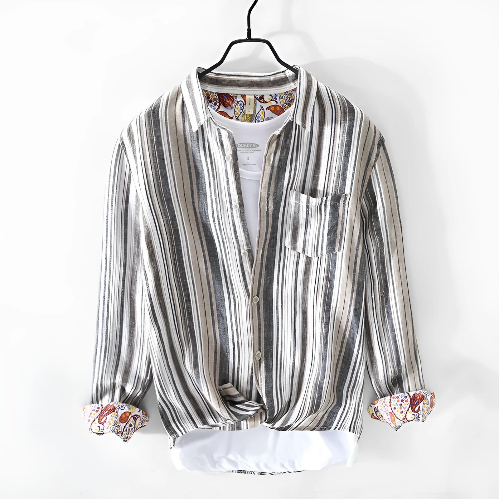 A man wearing a red and grey striped linen casual shirt with long sleeves and a loose fit.