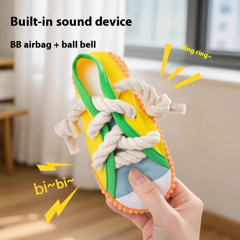 Squeaking plastic dog slipper chew toy in yellow, black, or blue colour.