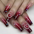 Wine red gradient plaid artificial nail tips with heart and pearl decorative elements in long ballet style