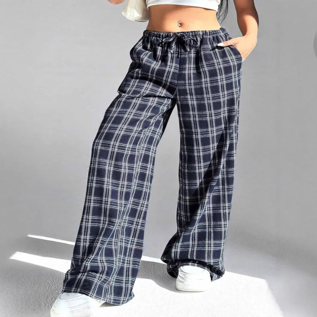 Women's red casual loose trousers with drawstring waist and plaid pockets on mannequin