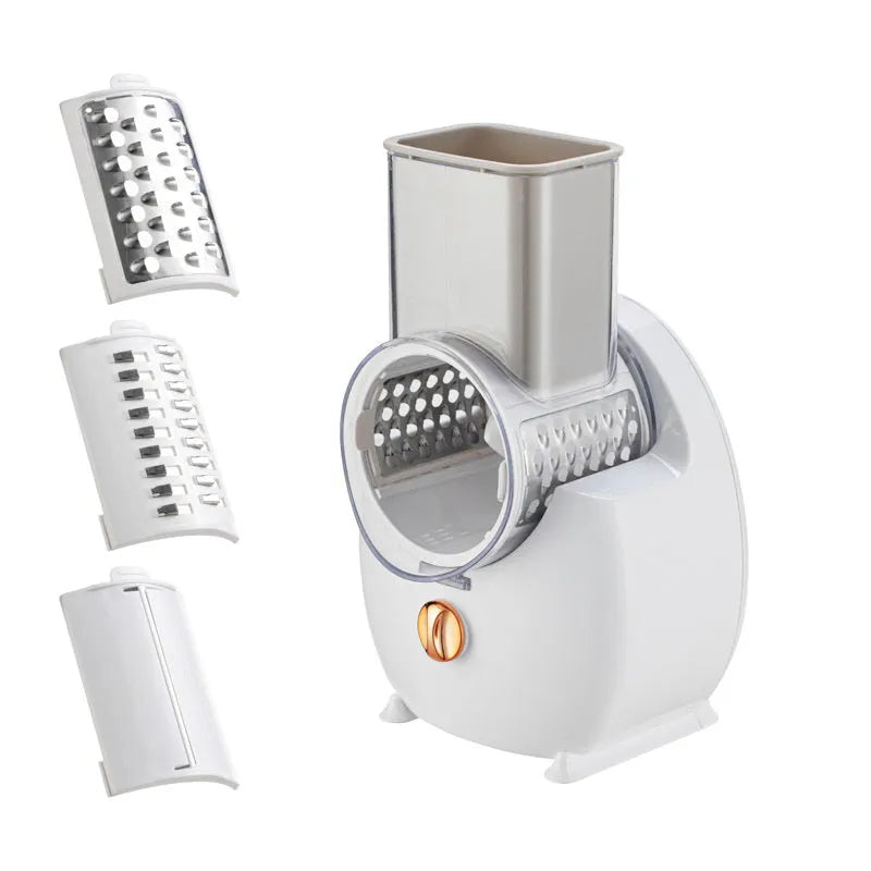 White electric vegetable slicer with suction base and interchangeable blades on kitchen counter