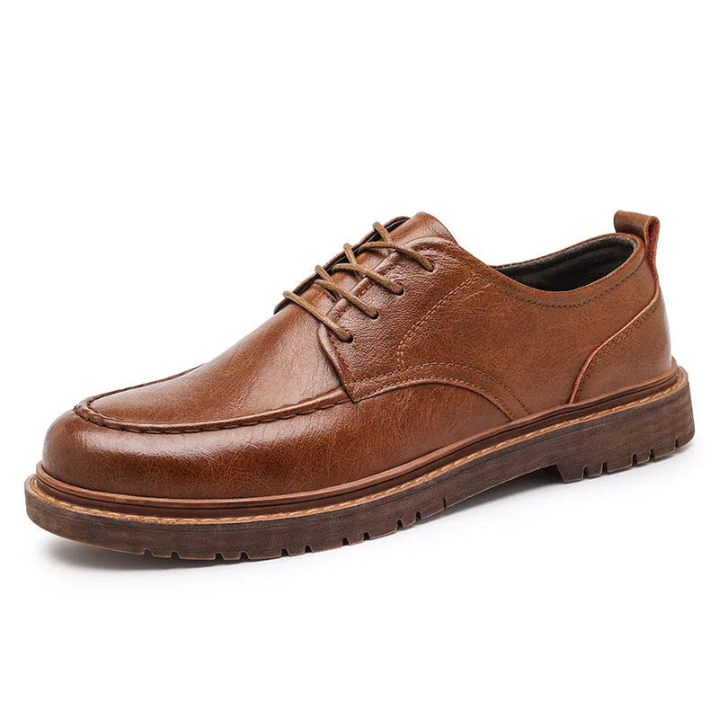 Brown low-top casual leather shoes with round toe and flat rubber sole on a white background.