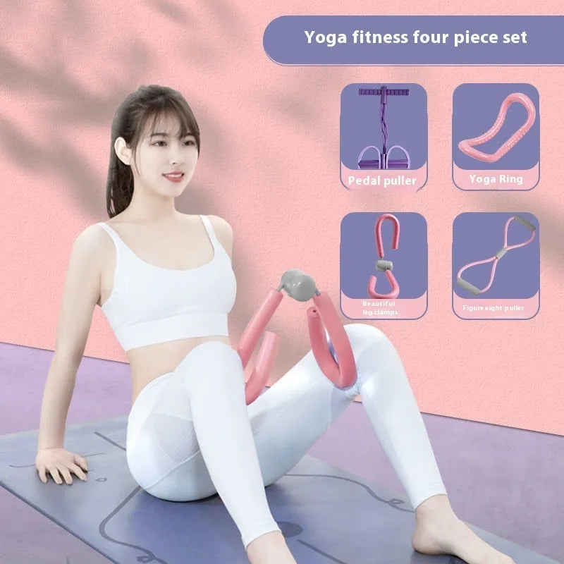 Yoga four piece fitness set with leg stretcher, yoga ring, pedal device, and figure eight tension rope on a plain background
