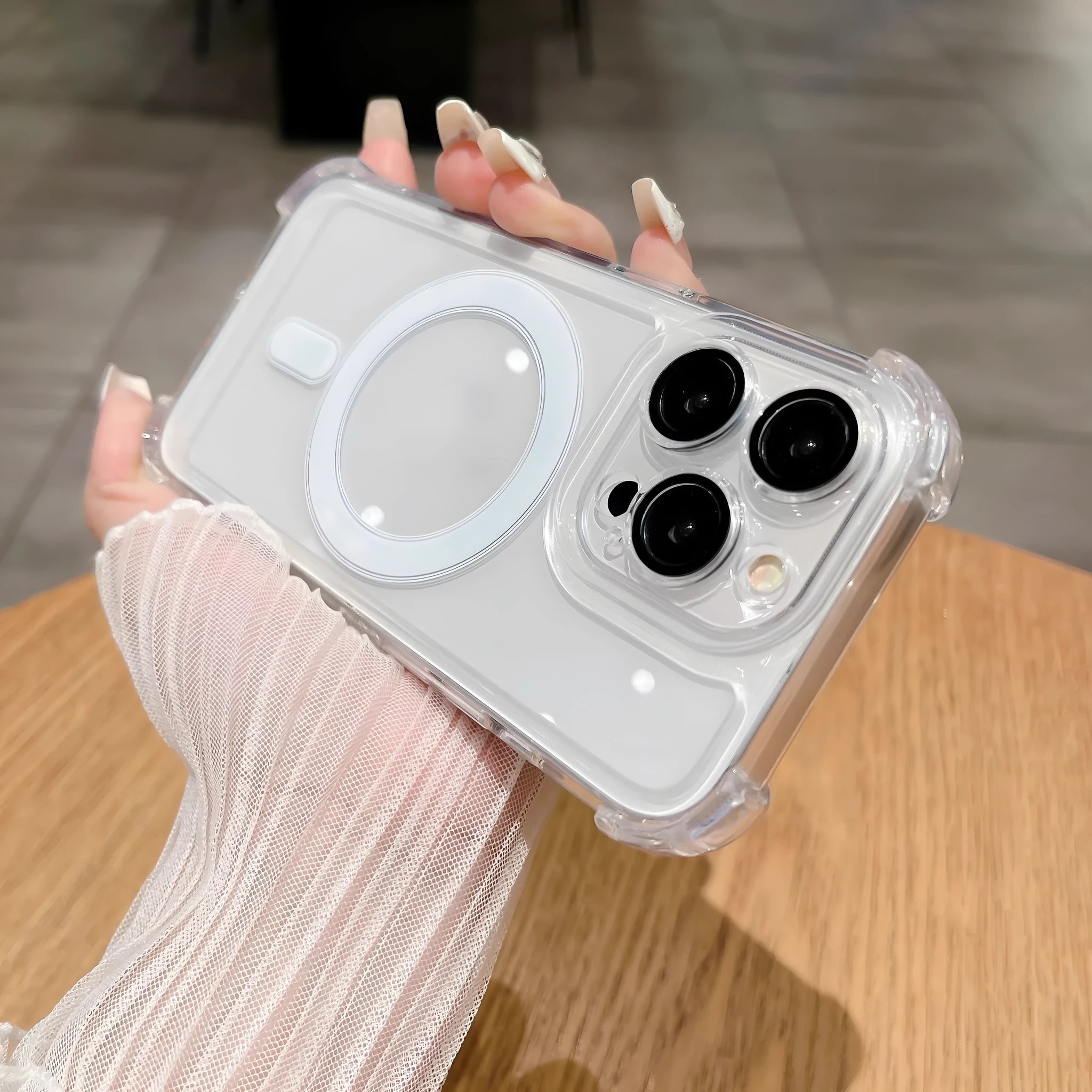Transparent airbag silicone phone case with magnetic rings and raised lens protector for iPhone.