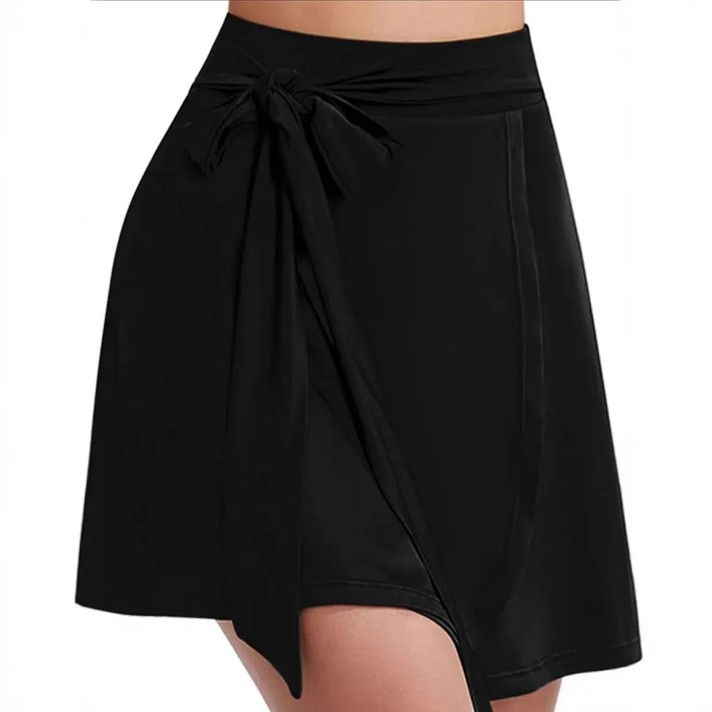 Black thigh-length sports culottes skirt with built-in shorts, high waist, and shoulder strap details