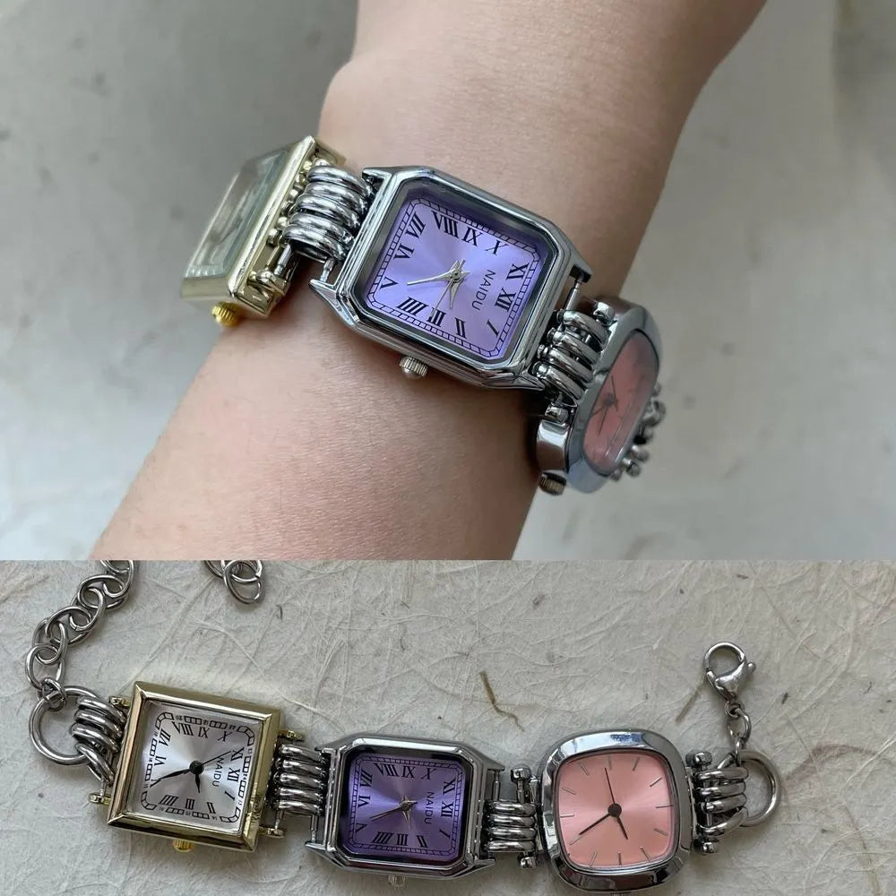Men's vintage retro punk watch with purple dial and metal bracelet on display