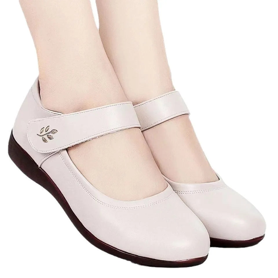 Women's softsoled peeptoe leather shoes with single strap, wedge heel, round toe, black and off-white options