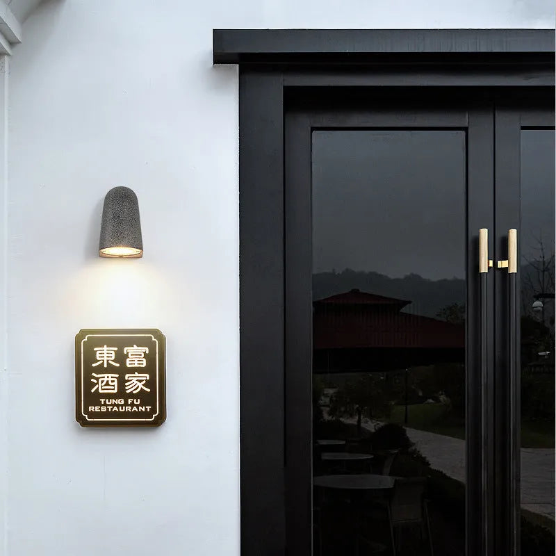 Cement outdoor wall lamp with decorative horseshoe shape, black sandstone finish, IP65 waterproof, with warm light