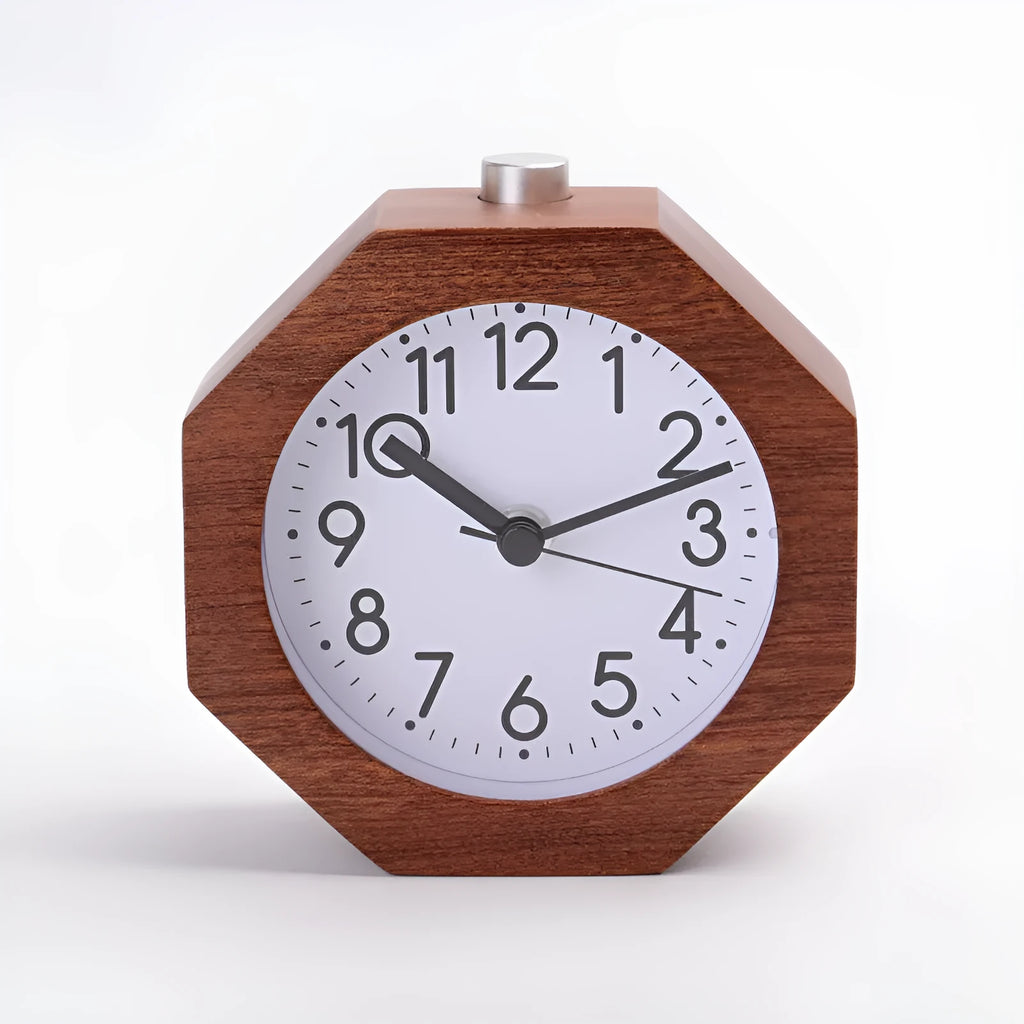 Wooden hexagonal alarm clock with luminous dial and beech finish on a nightstand