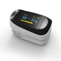 fingertip pulse oximeter with black OLED screen showing SPO2 and pulse rate readings