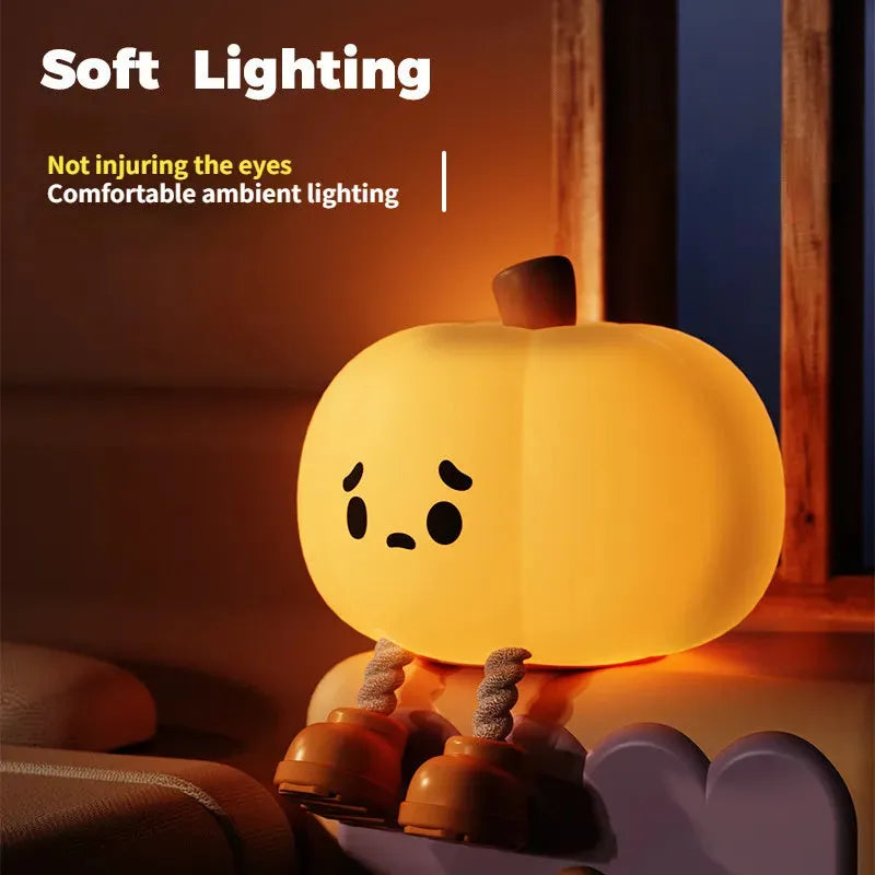 Soft silicone pumpkin-shaped night light with orange colour and touch dimming controls