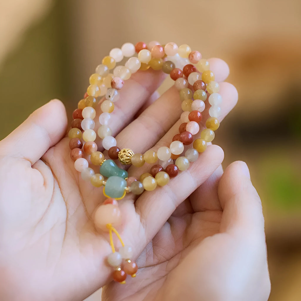 Women's Jinsi Jade bracelet with three-circle pumpkin design and tassels for 14-16cm wrists