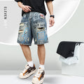 Blue men's ripped denim shorts with graffiti design and straight leg.