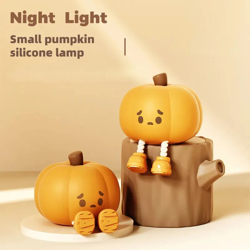 Soft silicone pumpkin-shaped night light with orange colour and touch dimming controls