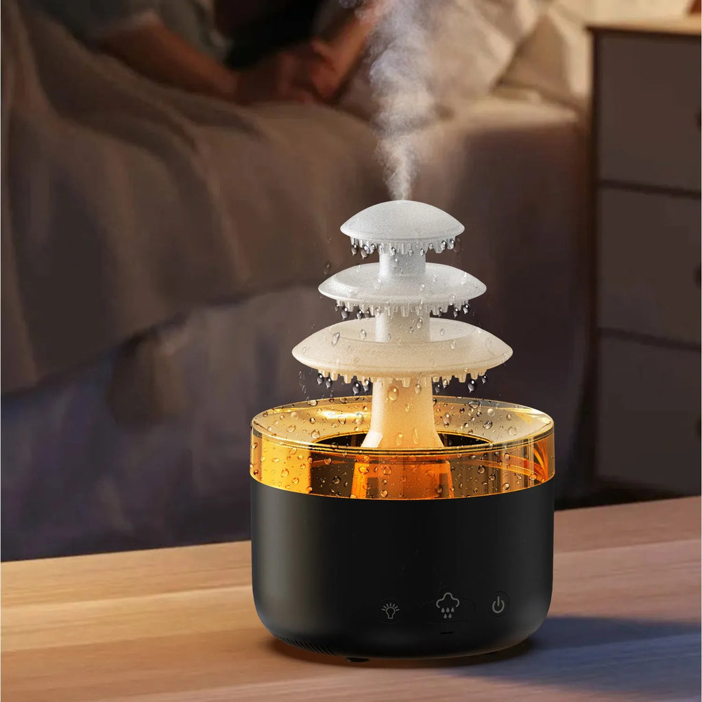 White cloud rain ultrasonic humidifier and essential oil diffuser with colourful LED lights on desk