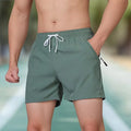 Man wearing black micro-elastic polyester high-waist sports shorts for running.