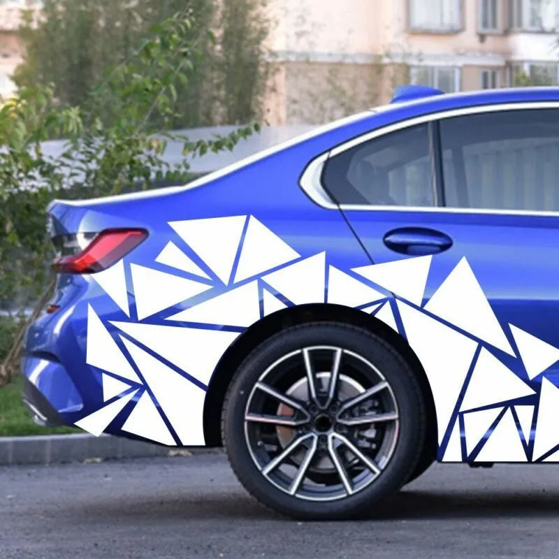 Long black geometric pattern car sticker laid flat, showing its 200cm length for wheel arch application.