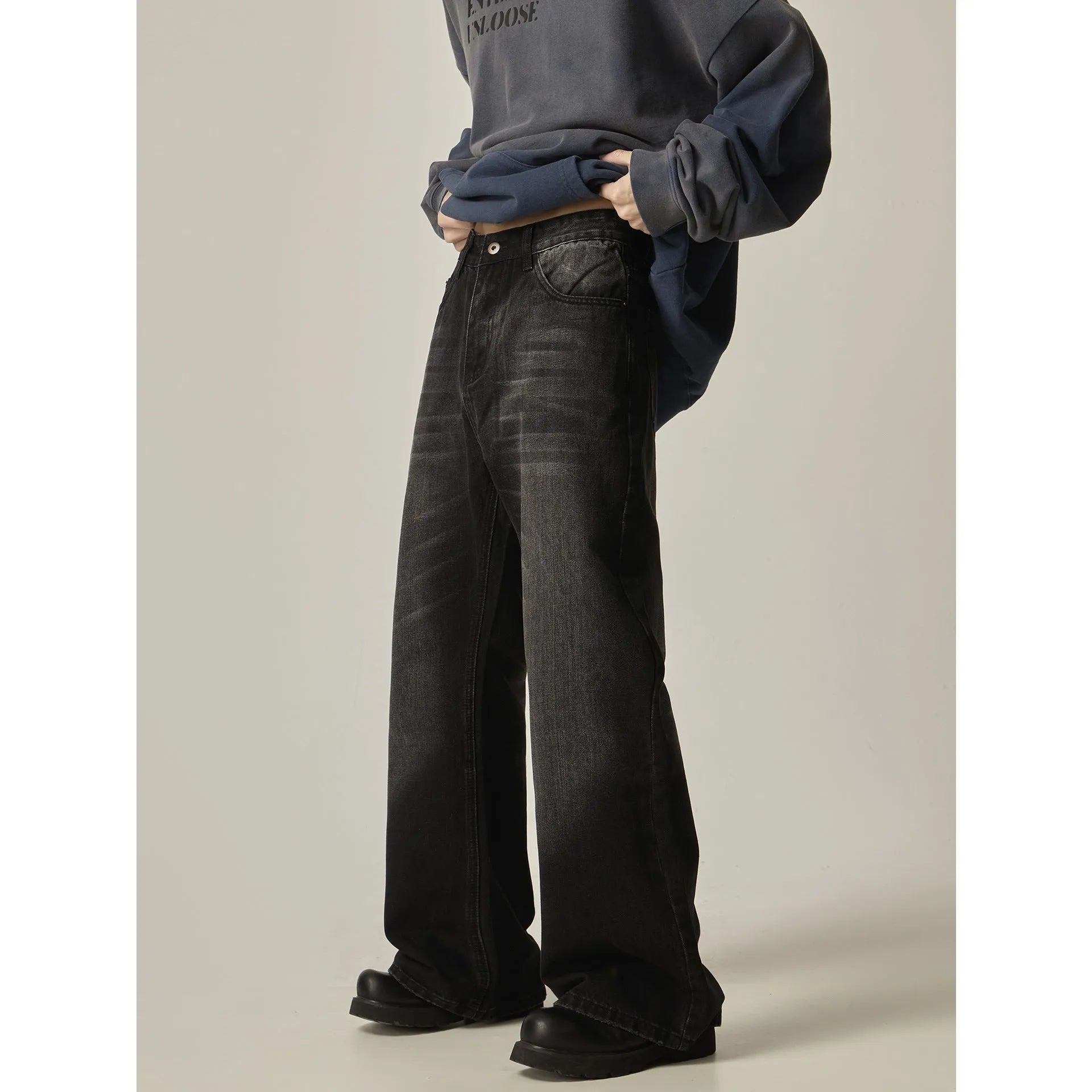 Black loose straight leg jeans with retro styling and zipper fly closure