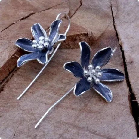 Purple flower-shaped alloy earrings with electroplated finish