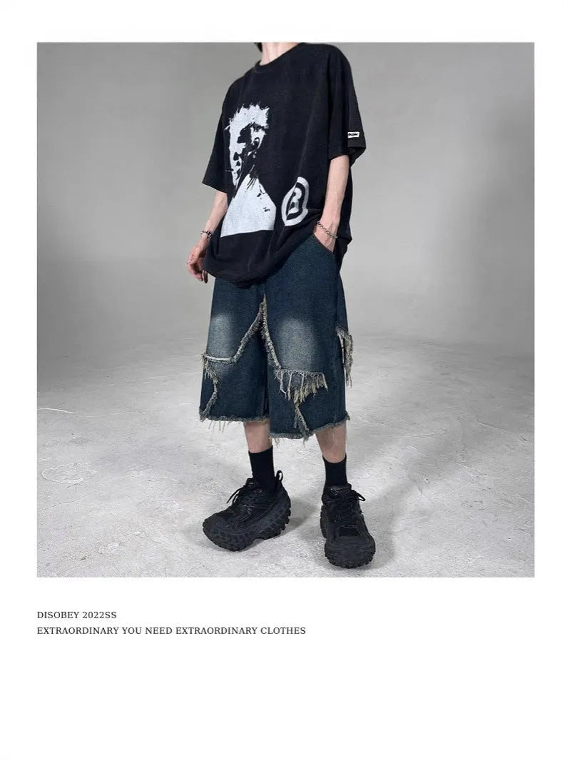 Men's blue denim shorts with frayed five-pointed star detailing and loose fit design