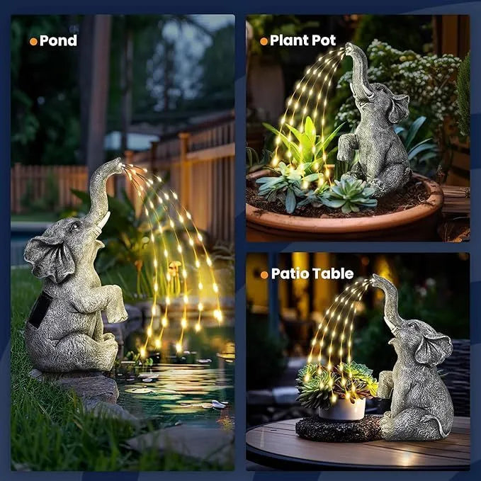 Outdoor resin elephant garden statue with integrated light strip on grass.
