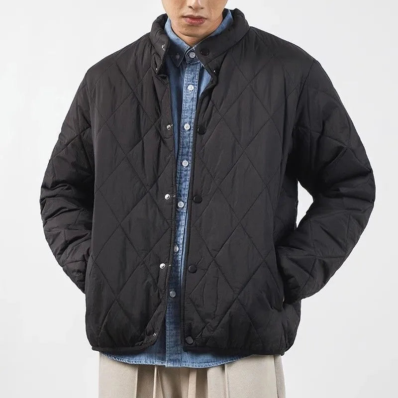 Men's black diamond lattice quilted cotton-padded jacket with extended length and loose fit.