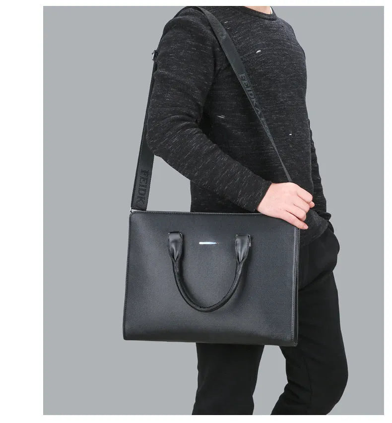 One-shoulder cross-slung male business briefcase in black PU leather horizontal square shape with stitching detail