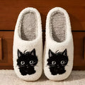 White plush slippers with a Black Beard Cat cartoon design on the toe.