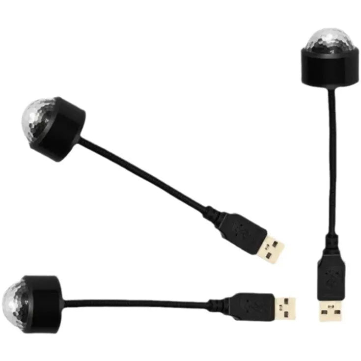 Black USB car atmosphere projection star light with ABS plastic housing plugging into vehicle dashboard