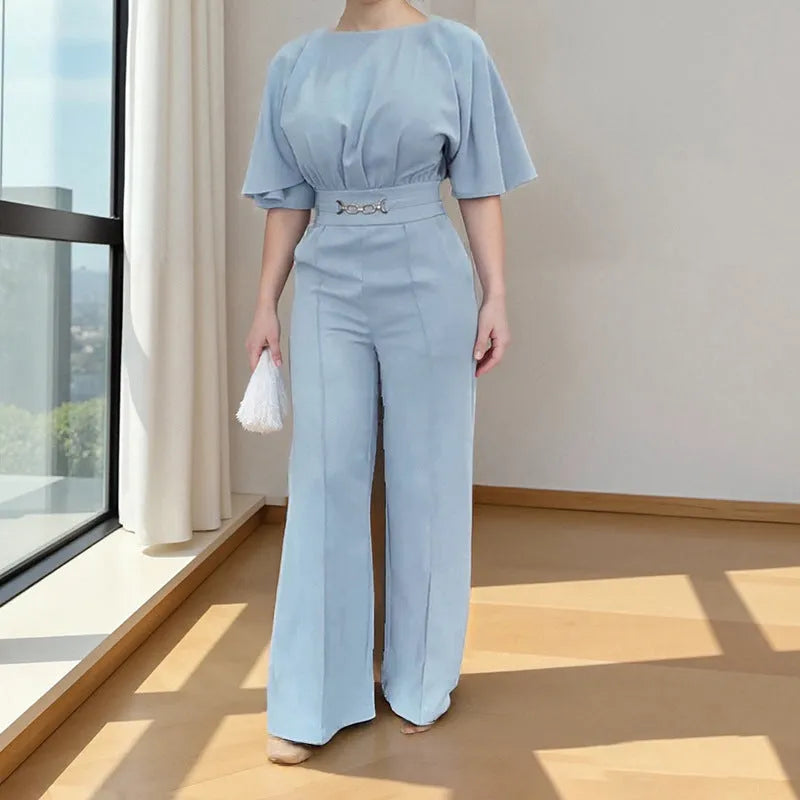 Blue men's two-piece polyester suit on a hanger, showing jacket and trousers.