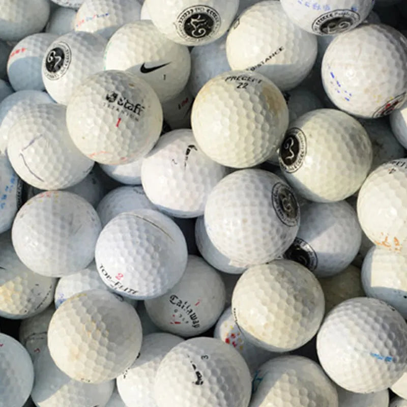 White Golf Next Practice Game Ball with 352 beehive holes and synthetic rubber core, second-hand condition