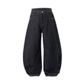 Men's wide leg denim trousers in original cow colour showing relaxed fit and mid waist design.