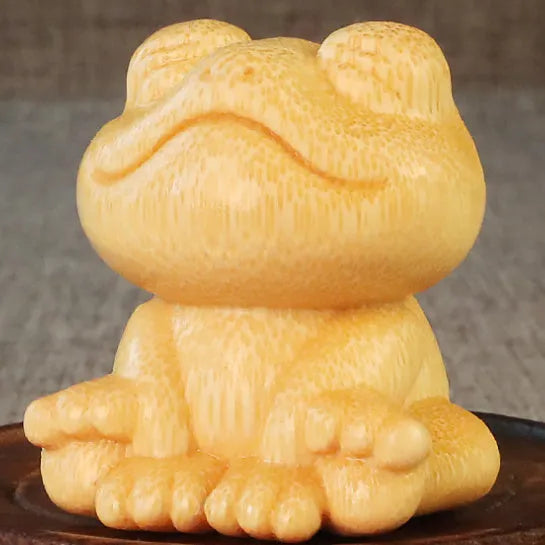 Solid bamboo carved smiling frog ornament with cartoon cute style, measuring 5cm high.
