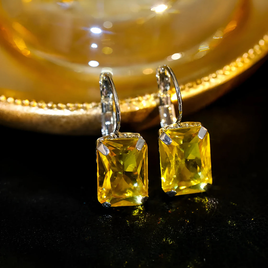 Square crystal drop earrings made from copper in purple, red, or yellow colours measuring 25mm by 10mm