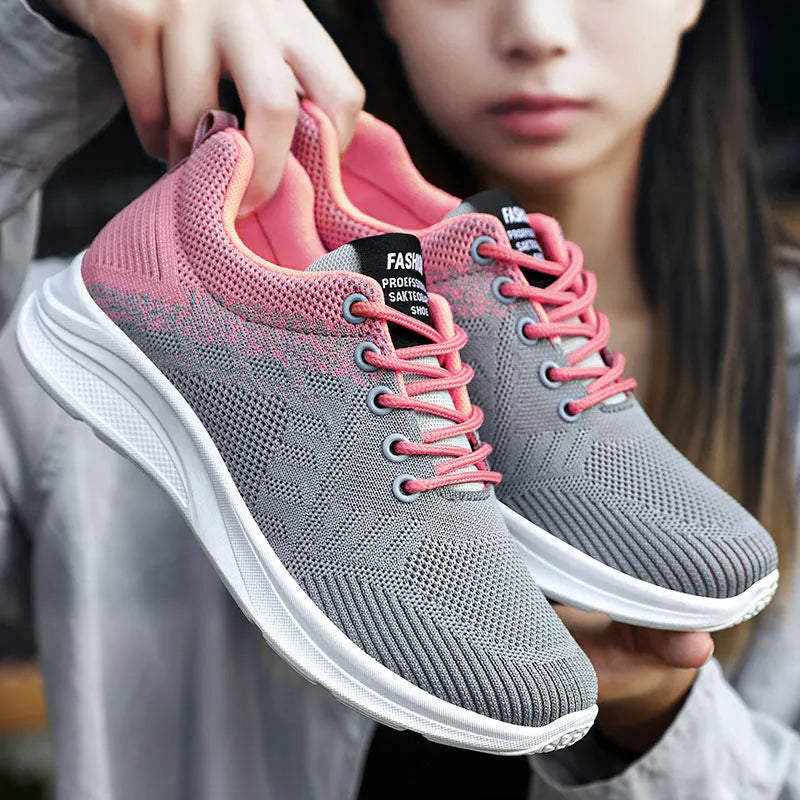 Spring Sole women's casual sports shoes in grey with mesh upper and white PVC sole on a light background