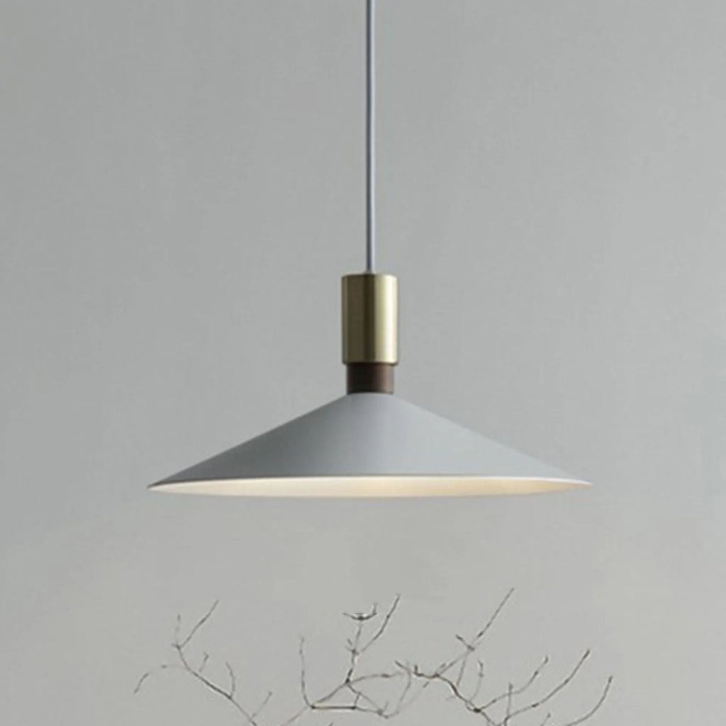 Minimalist round single-headed iron pendant lamp in black, shown in a dining setting.