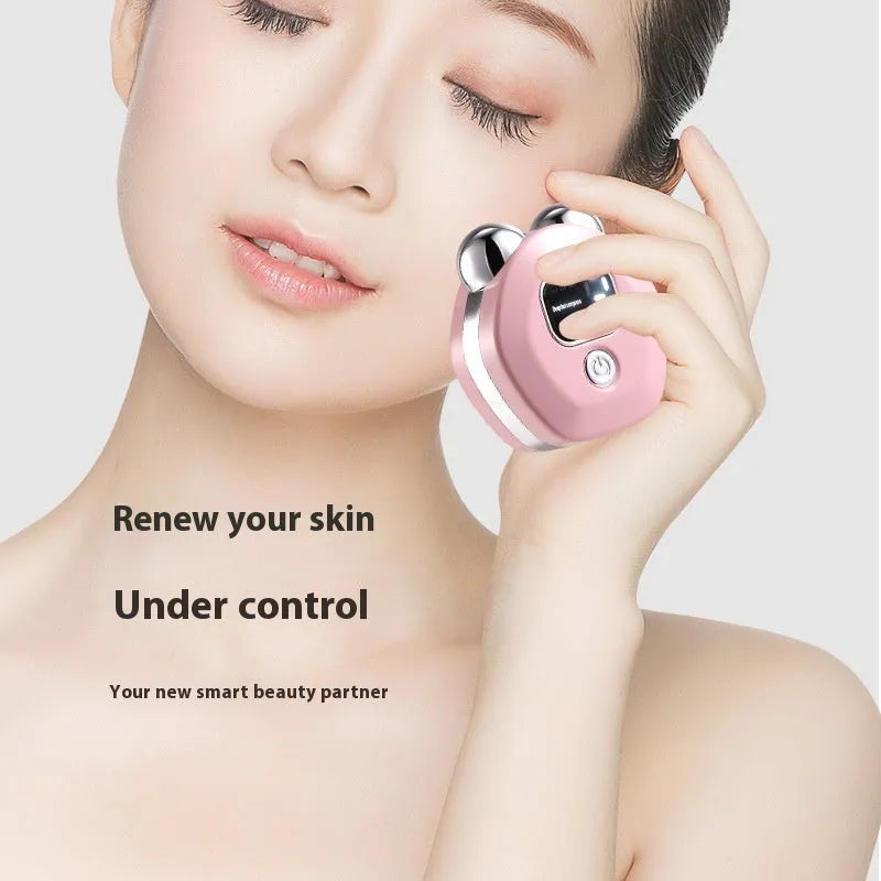 Portable hot compress facial massage instrument with micro current double-roller in light blue, pink, or white.